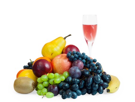 a lot of fruit and a glass of rose wine isolated on whiteの写真素材
