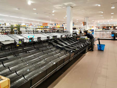 16/03/2020 - Almere / Netherlands: Empty shelves in a supermarket in Netherlands. Stockpiling. Panic buyingのeditorial素材