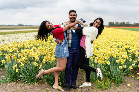 Lisse/Netherlands - 05/04/2019: Narcissus fields. Vacation in the Netherland, young people.