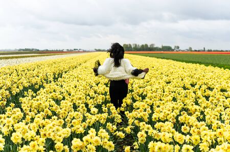 Young people in the fields of Netherlandsの写真素材