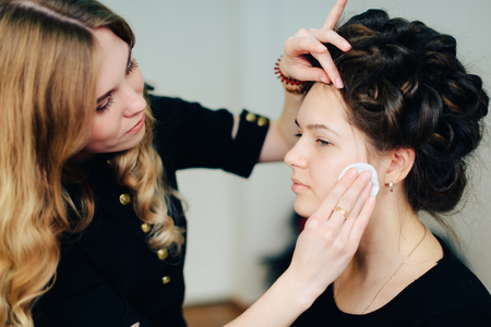 stylist working in a beauty salon and a nice ladyの写真素材