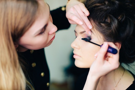 stylist working in a beauty salon and a nice ladyの写真素材