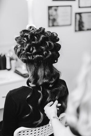 stylist working in a beauty salon and a nice ladyの写真素材