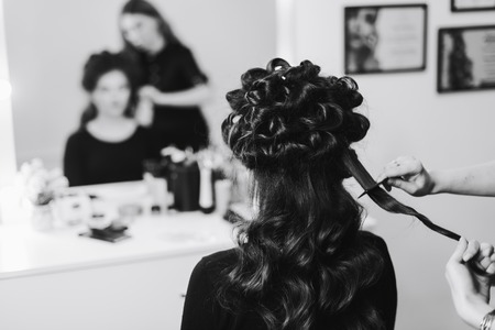 stylist working in a beauty salon and a nice ladyの写真素材