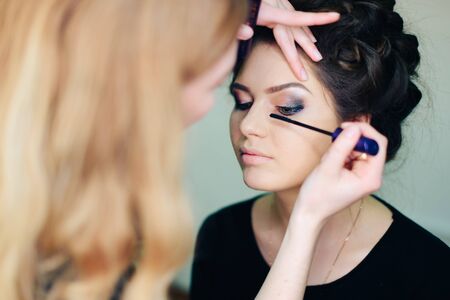 stylist working in a beauty salon and a nice ladyの写真素材