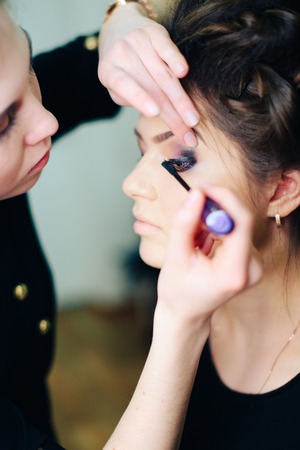 stylist working in a beauty salon and a nice ladyの写真素材