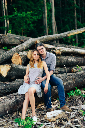 Boyfriend and girlfriend, loving couple walking and kissing at sunset in rural mestres on natureの写真素材