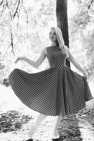 girl in black and white dress in nature on a backgroundの写真素材