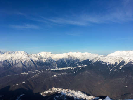 a landscape of snow-capped Caucasian mountains