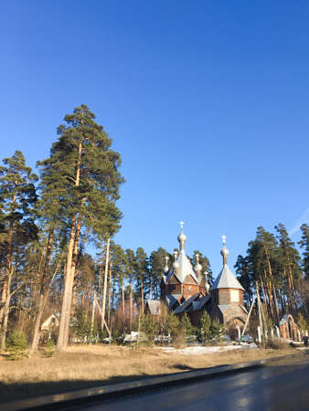Wooden Christian Church in the pine forest 1の写真素材
