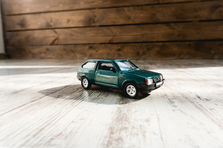small model of old russian car close up on wooden backgroundの写真素材