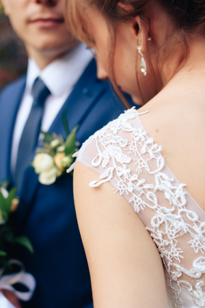 young beautiful newlywed couple on nature in summerの写真素材