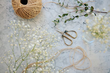 set of scissors and craft paper on wooden backgroundの写真素材