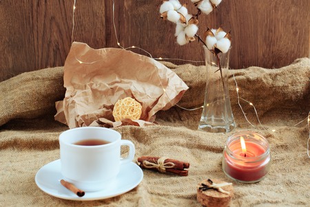 cup of coffee on a wooden background, set in warm brown tonesの写真素材