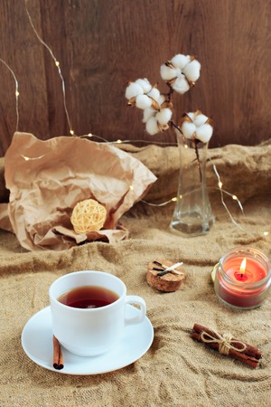 cup of coffee on a wooden background, set in warm brown tonesの写真素材