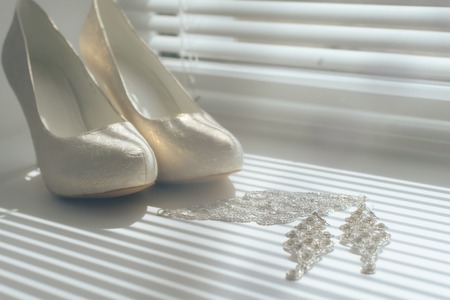 morning set of the bride for a wedding, shoes and earringsの写真素材