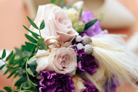 beautiful wedding bouquet of flowers on a light backgroundの写真素材