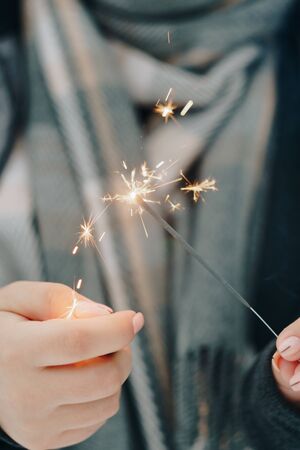 girl with sparkler in handsの写真素材