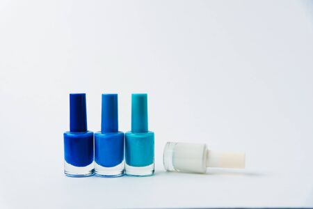 colored nail polishes on a white backgroundの写真素材