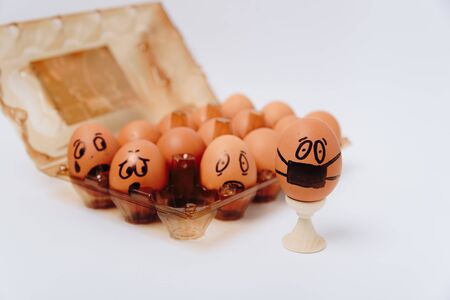 chicken egg with medical mask , Easter egg on white background