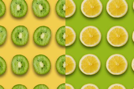 summer pattern with juicy ripe fresh a lemon and kiwi on a yellow and green backgroundの写真素材