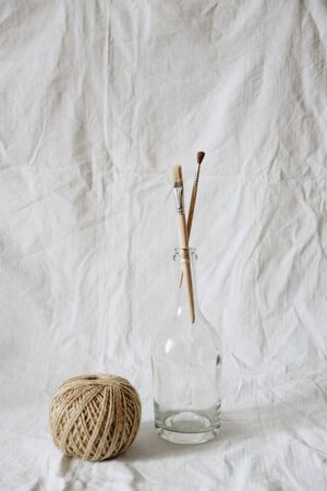 Transparent glassware on a light fabric backgroundの写真素材