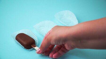 Ice cream on a stick on a blue background