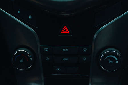 dashboard in a car with emergency lights on 1