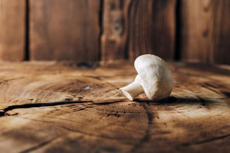 Mushrooms on a wooden background close upの写真素材