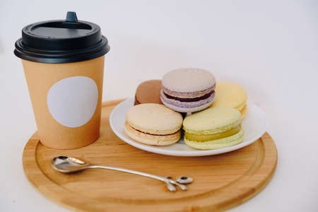 Several colorful macaroon cakes on a colored background 1