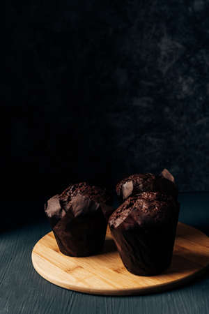 chocolate cupcakes close up on a dark background