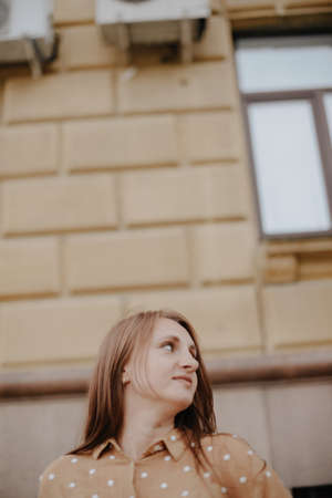 Portrait of a beautiful young woman with natural light outdoors in the city
