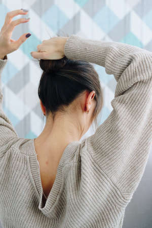 portrait of a beautiful brunette girl at homeの写真素材