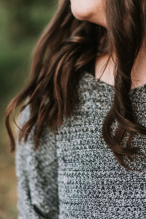 Portrait of a young adult girl on the background of a modern buildingの写真素材