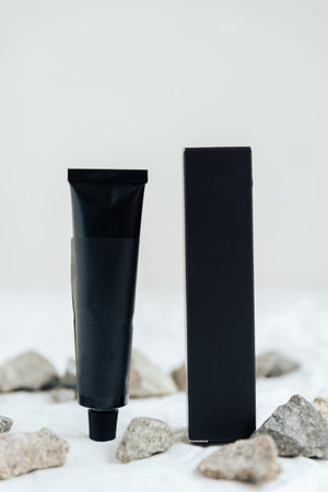 Black tubes with cosmetic cream, health care