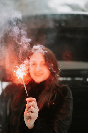 Portrait of a woman with sparklers in her hands
