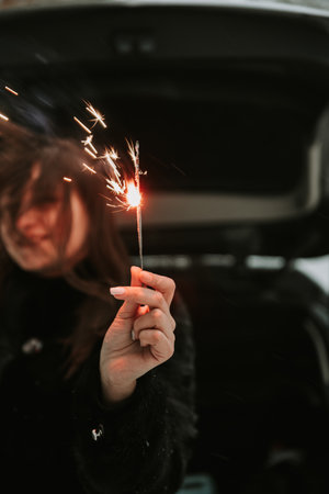 Portrait of a woman with sparklers in her hands