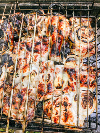 Grilled meat on a barbecue grill close-up 1