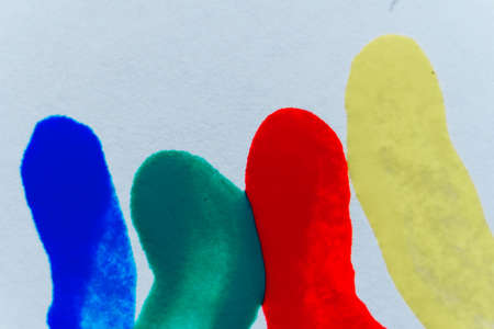 multi- colored nail polishes and traces of them on a white backgroundの写真素材