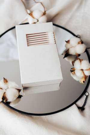 Cotton swabs in a white box and white cotton 1の写真素材