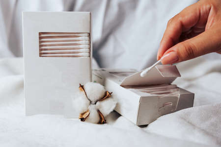 Cotton swabs in a white box and white cotton 1の写真素材
