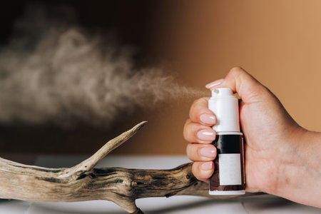 Spray dry shampoo close-up on a colored backgroundの写真素材