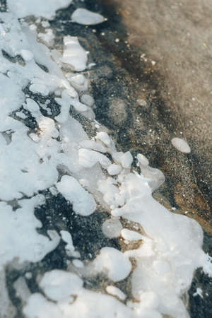 Ice on the river near the shoreの写真素材