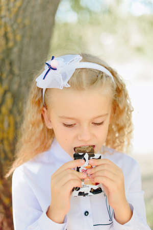 Children with candy in their handsの写真素材