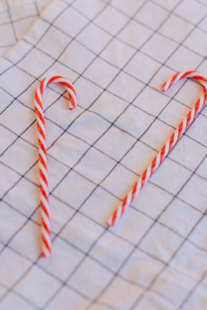 Christmas lollipops on a fabric background close-upの写真素材