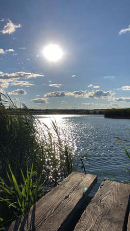 Beautiful summer sunset over a pond in the countrysideの写真素材