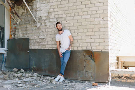 A handsome young man with a beard in a grunge-style interior 1の写真素材