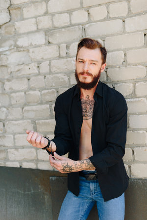 A handsome young man with a beard in a grunge-style interior 1の写真素材