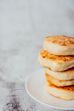 Cottage cheese cheesecakes on a wooden boardの写真素材