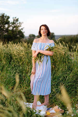 Beautiful young woman in summer in a wheat field 1の写真素材